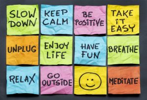 post it notes saying slow down, relax, take it easy, keep calm and other motivational lifestyle reminders