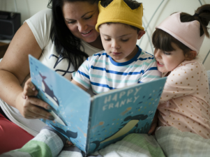 disabled child and family reading story