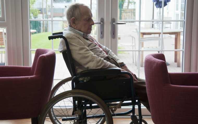 older man alone in wheelchair