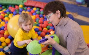 Child and mother playing contact