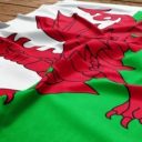 Flag of Wales on a wooden desk background