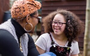 Social worker and girl talking