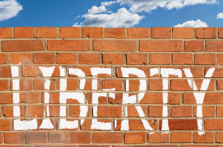 Abstract brick wall with 'liberty' written on it