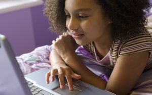 girl on a laptop at home