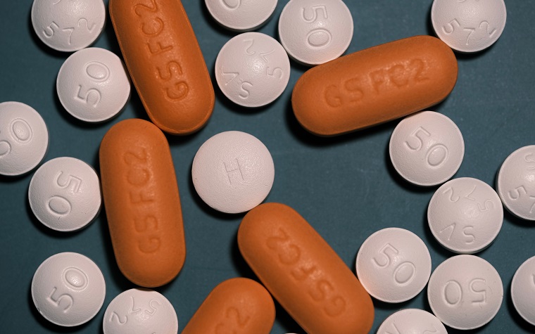 orange and white pills - Antiretroviral dugs