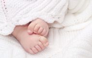 Close up of baby feet on blanket