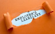 The word's 'Employer's Liability' typed and revealed by torn paper