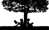 Silhouettes of people with a book.