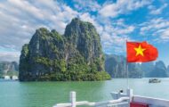 Landscape with Halong bay and Vietnamese flag, Vietnam