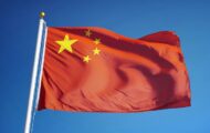 China flag (red with one large gold star surrounded by four smaller gold stars in the top left-hand corner against a blue sky