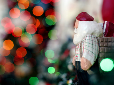 A santa toy and christmas tree