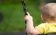 Baby_on_swing_posed_by_model