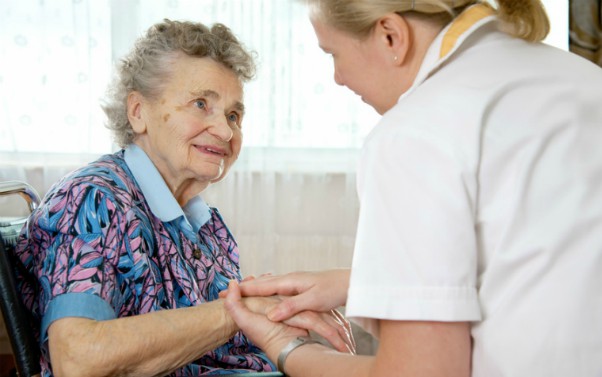 description_of_image_used_in_continuing_healthcare_tips_piece_older_woman_with_nurse_Alexander_Raths_Fotolia