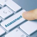 Image of computer key marked 'assessment' (Credit: momius / Adobe Stock)