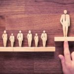 description_of_image_used_in_practitioner_manager_piece_person_standing_above_others_fotolia_Jakub_Jirsák