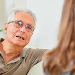 description_of_image_used_in_quick_guide_to_questions_older_man_talking_to_social_work_fotolia_Kurhan 600