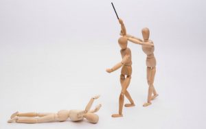 description_of_image_used_in_foresnic_social_work_article_stick_figures_violence_Hans-Joerg-Hellwig_fotolia