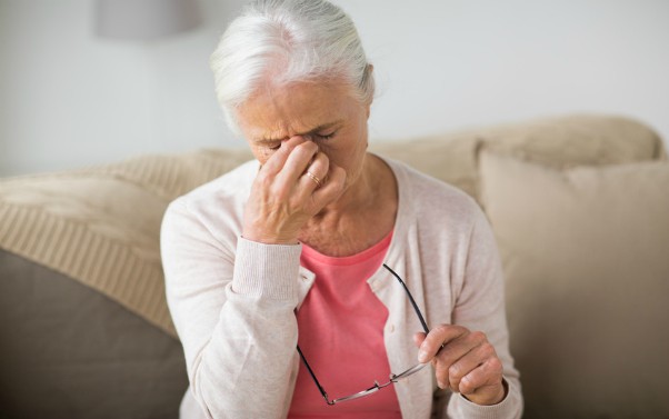 An older person looking stressed