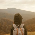 woman looking at view from mountains