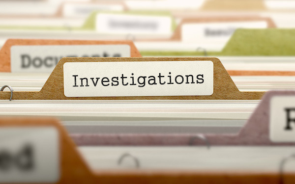 Image of filing cabinet with 'investigations' label