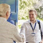 Male social worker on home visit to older man