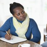 Social worker assessing older woman