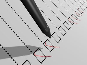 Image of a pen completing a checklist (credit: JNT Visual / Adobe Stock)