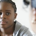 black girl talking to adult woman