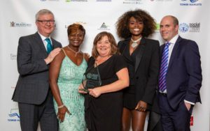 Louise Pashley, overall winner at the Social Worker of the Year Awards (centre), with (from left) chair of trustees Peter Hay, awards founder Beverely Williams, awards patron and presenter Lorraine Pascale and James Rook,, chief executive of headline sponsor Sanctuary Peronnel
