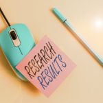 Research results post-it note on mouse