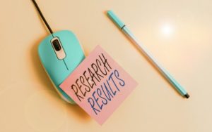 Research results post-it note on mouse