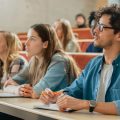 Image of students in lecture theatre (credit: Gorodenkoff / Adobe Stock)