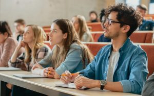 Image of students in lecture theatre (credit: Gorodenkoff / Adobe Stock)