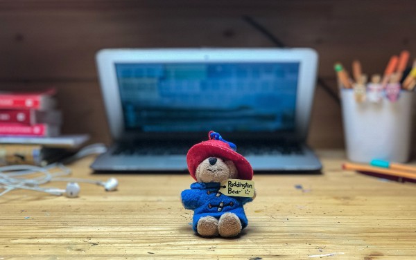 Toy in front of laptop