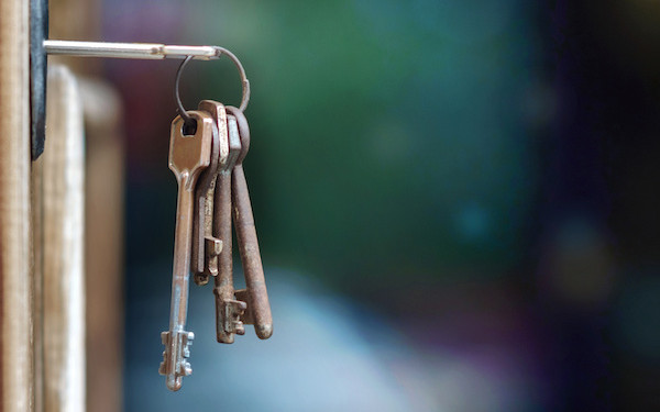 Image of door with keys in (credit: Luka / Adobe Stock)
