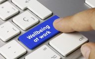 'Wellbeing at work' key being pressed on keyboard