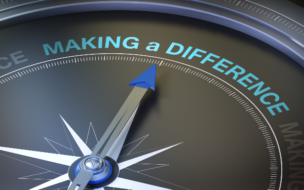 A dial pointing at the words 'Making a difference'