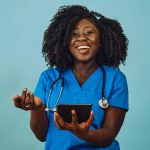 Nurse practitioner doctor with tablet and stethoscope laughing