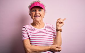 An older woman wearing a cap