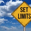 Set limits metallic vintage sign over blue sky with clouds