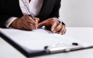 woman writing on clipboard (inspection)