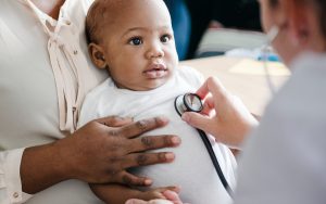 Baby being seen by a doctor