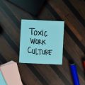 Toxic work culture written on postit note