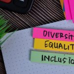 Diversity Equality Inclusion write on a sticky note isolated on Office Desk.