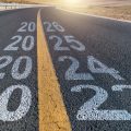 Empty asphalt highway with number 2023, 2024, 2025 and 2026