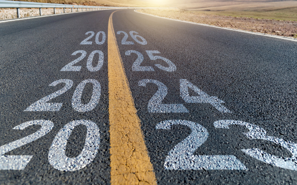 Empty asphalt highway with number 2023, 2024, 2025 and 2026