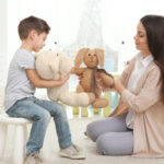 Young child psychologist working with little boy