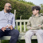 Social worker talking to boy