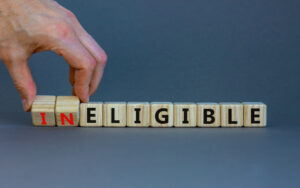 Blocks spelling out the word 'ineligible'