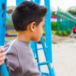 boy swinging on a swing